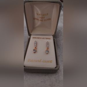 Ladies beautiful blue topaz dangling earrings with diamond accents.  Gold/SS
